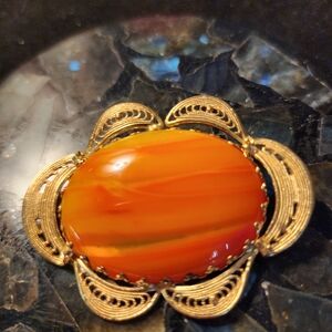 Elegant Gold and Orange Brooch